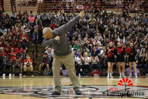 Coach Scott Chalk "hit the dab" at the pep rally on Tuesday, Mar. 15