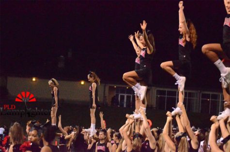 The cheerleaders practice libs on the sidelines of the Lafayette v Dunbar football game