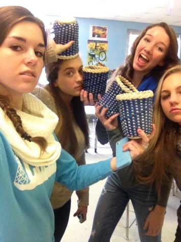 Seniors Alyssa Hogan and Claire Huskey show off their baskets with Juniors Rosie Halpin and Lily Daily.