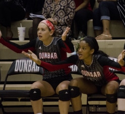Katie Shunk (left) and Leah Edmond (right) react to a play