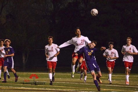 #20 Javier Delgado goes up for the ball