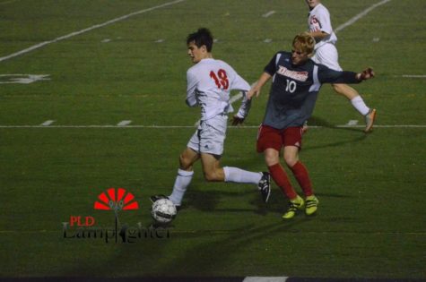 Junior Jackson Akins pushes down the field during the second half