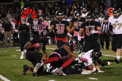 Dunbar players tackle their opponent.