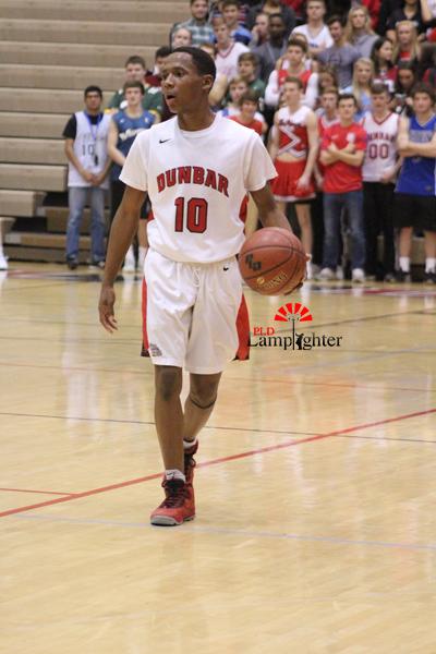 Junior JaQuice Gray dribbles the ball.