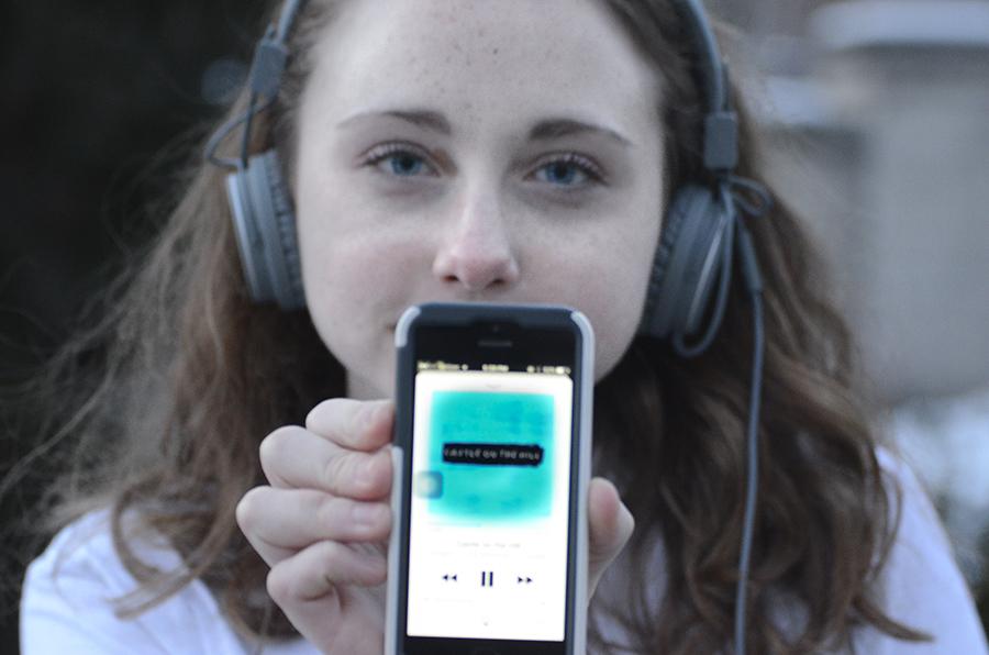 Junior Remy Milburn listens to Ed Sheerans new singles on her iPhone.
