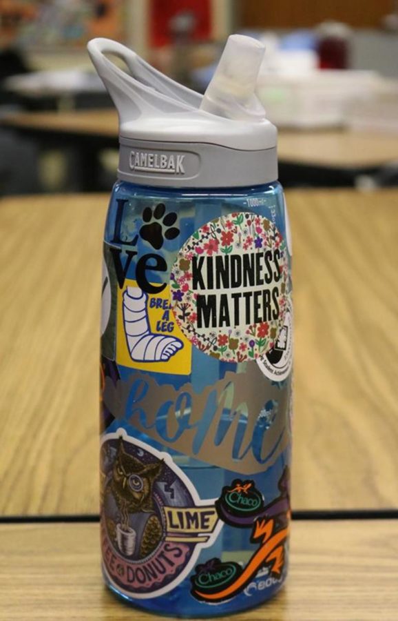 Junior Mackenzie McConnells reusable water bottle is decorated with stickers that reflect her personality and interests.
