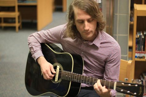 English teacher Mr. Trevor Tremaine plays guitar and other instruments in his band, ATTEMPT.