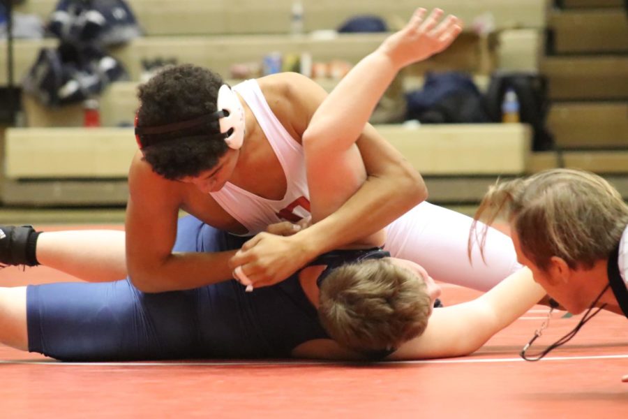 A competitor from Dunbar attempting to pin his opponent
