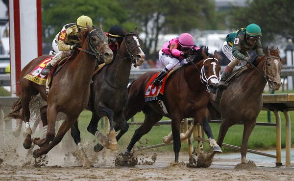 Flavien Prat on Country House, left, races against Luis Saez on Maximum Security.