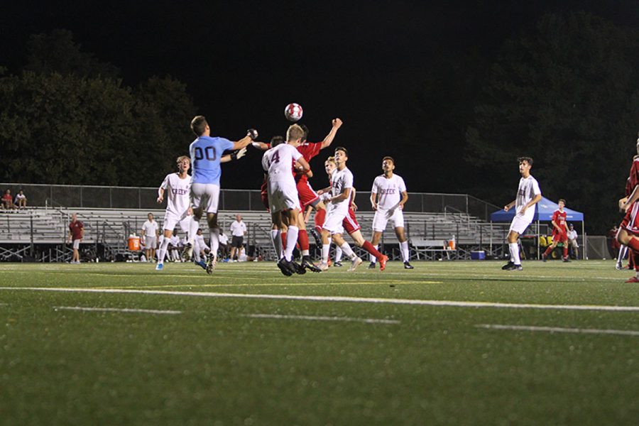 In a hard fought match, #12 Derek Burgess goes up trying to get Dunbar their second goal following a Dunbar corner kick.