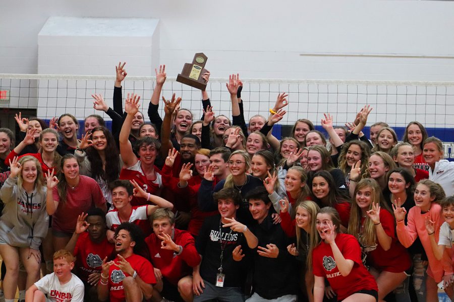 Dunbar Volleyball Team and Dunbar Fans celebrate their win in the district championship.