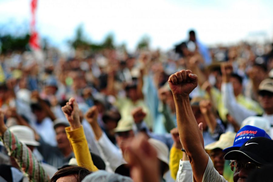 People raising their fists in protest 