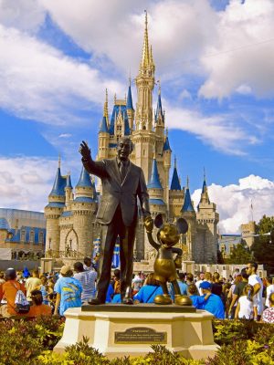 Walt Disney depicted in a statue with the iconic Mickey Mouse in Walt Disney World, Orlando Florida. 
