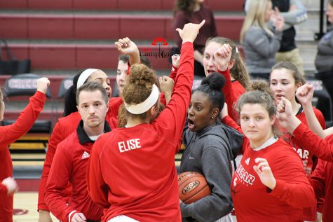 The girls basketball team does their team chant before tip-off in 
 February 2020. 