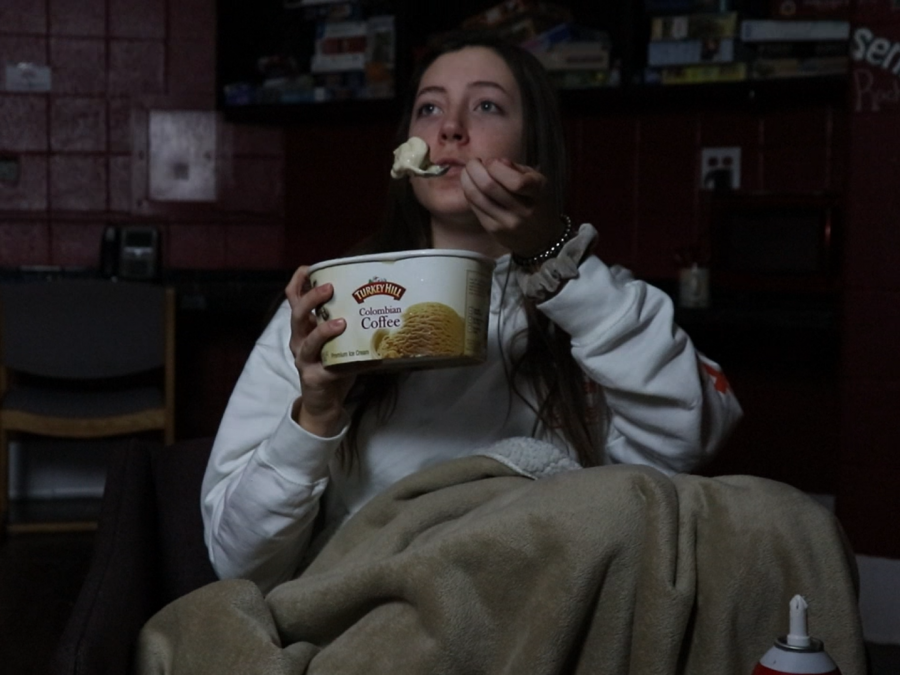 Single teenage girl enjoying her ice cream and whipped cream for Valentines Day.