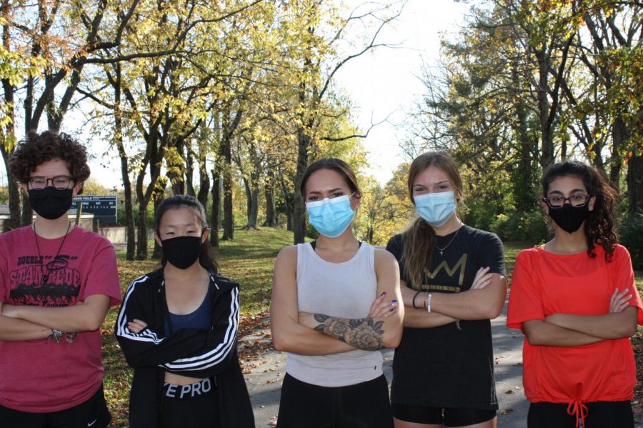 The Dunbar cross country team gets ready to run together with the safety of masks.