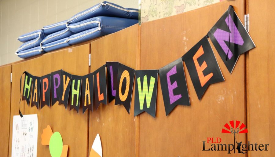 In big, bold letters, this banner in room 802 lets everyone know that it’s spooky season.