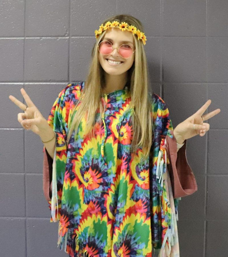 English teacher Ms. Laska Anderson brought a groovy vibe to school with her 60s costume.