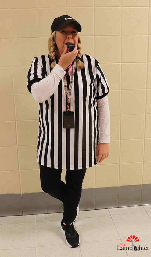 English teacher Mrs. Kari Long dressed as a referee complete with a whistle.