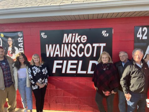 Family members including son Wes Wainscott, granddaughter Haleigh Roberts, and wife Sherri Wainscott attended the dedication to Coach Mike Wainscott.