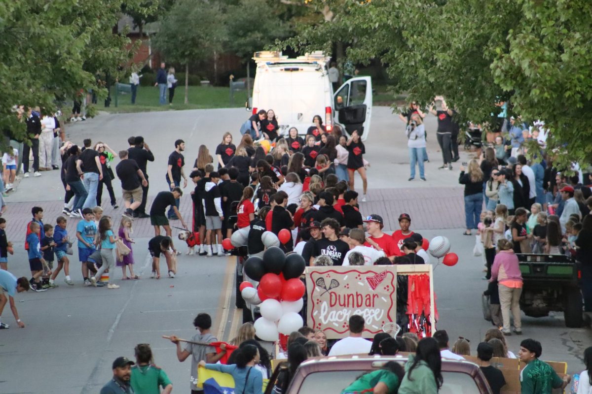 The Dunbar community walks through Palomar for the homecoming parade.