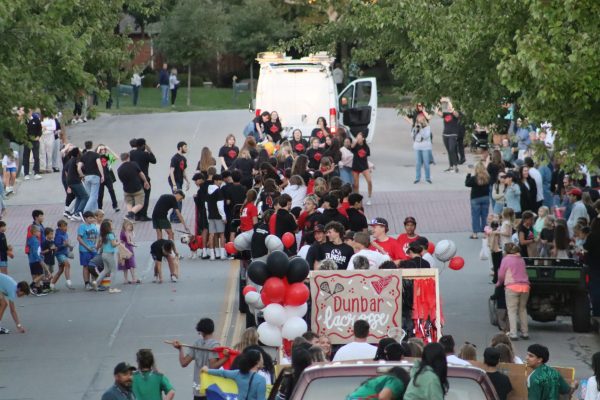 The Dunbar community walks through Palomar for the homecoming parade.