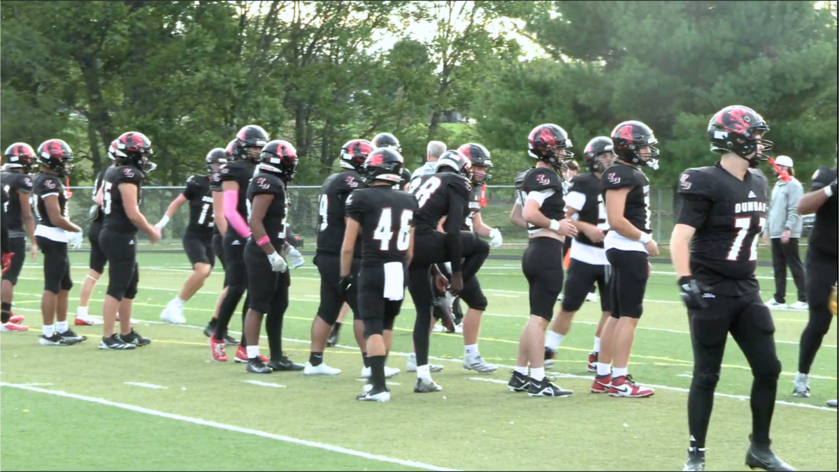 Players warm up before the homecoming game vs. Tates Creek.