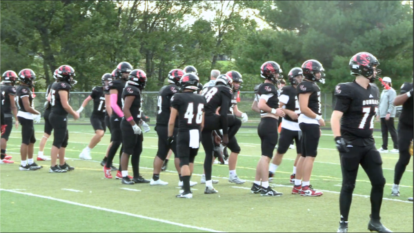 Players warm up before the homecoming game vs. Tates Creek.