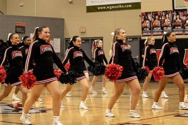 The Cheerleaders perform the fight song every basketball game to get the crowd hype!