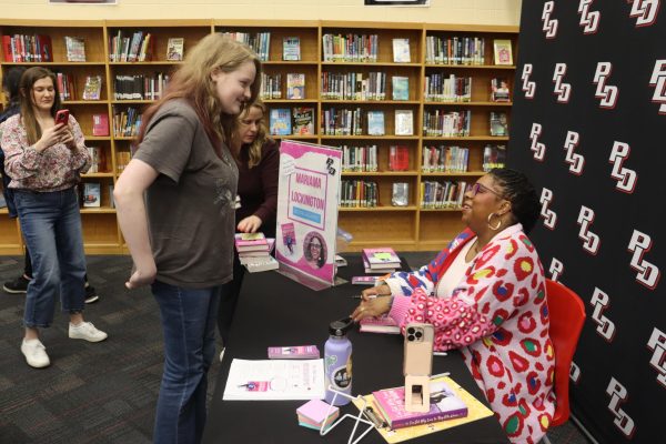 Mariama Lockington speaks to a student during her book signing.