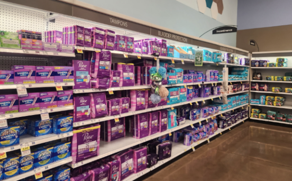 Aisle of Kroger stocked with a variety of menstrual products.
