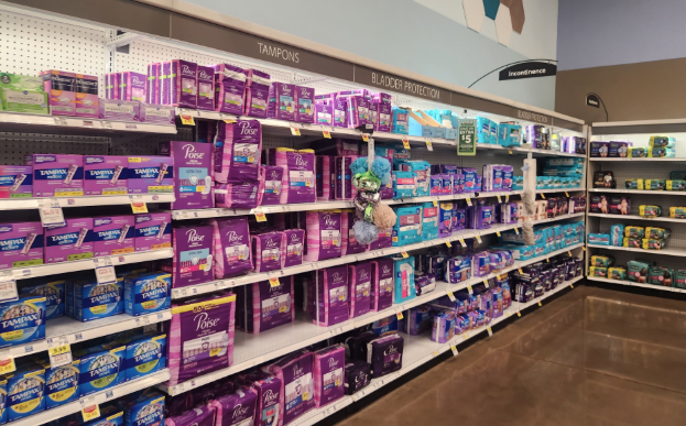 Aisle of Kroger stocked with a variety of menstrual products.